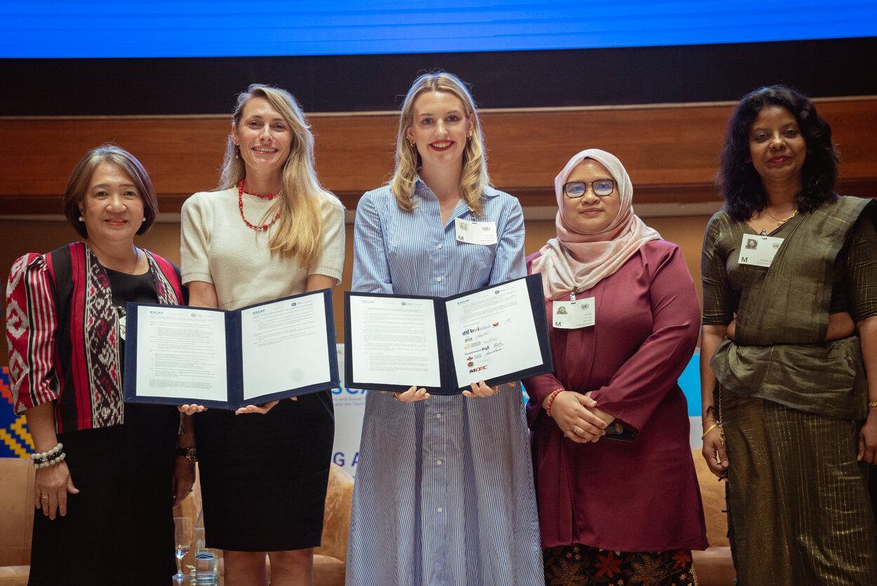 ESCAP and FDI Center representatives stand together