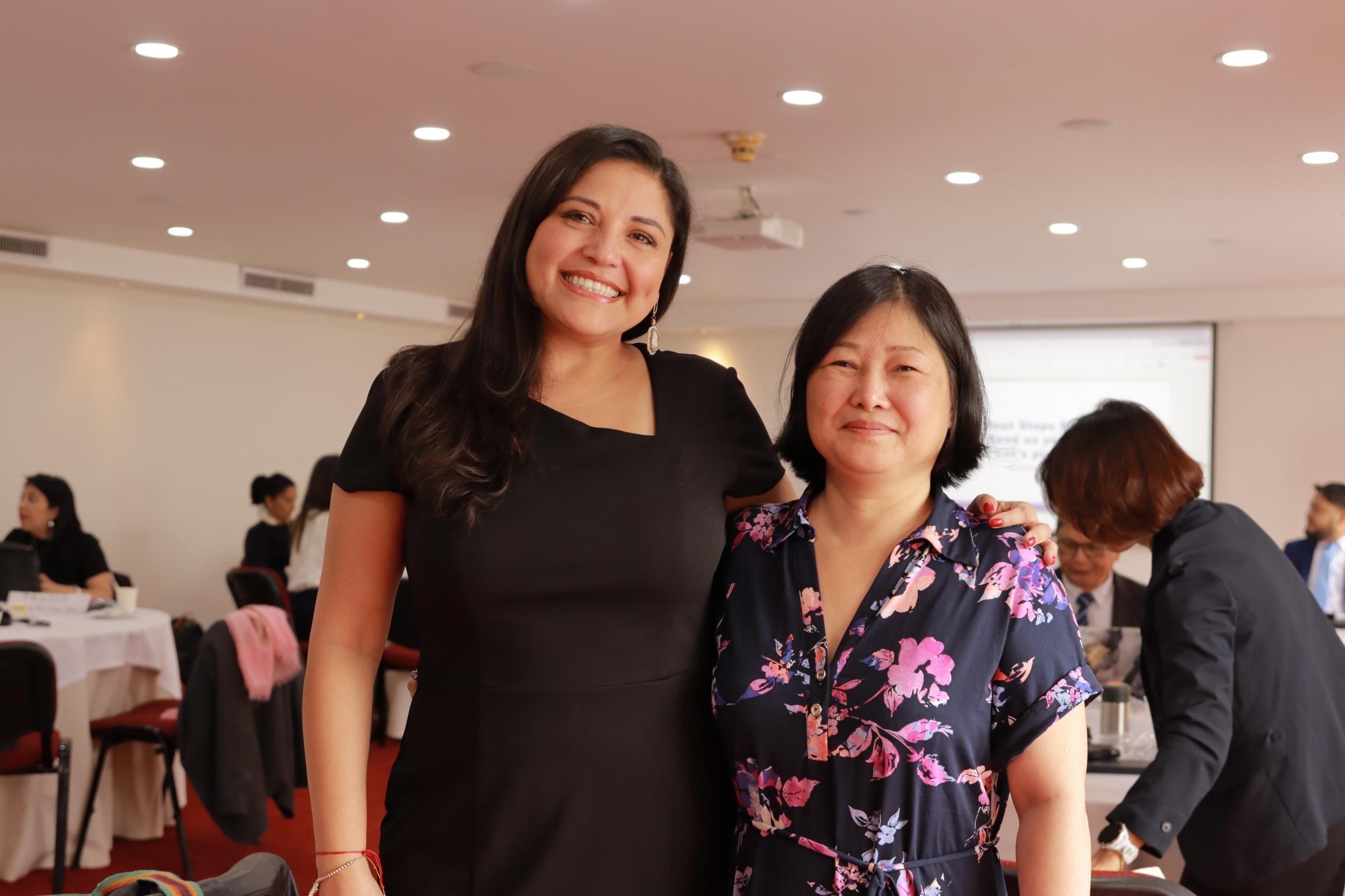 Two people stand together